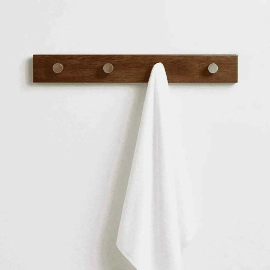 Rosewood hook rack straight-on front view, white towel hung from the centre metal peg