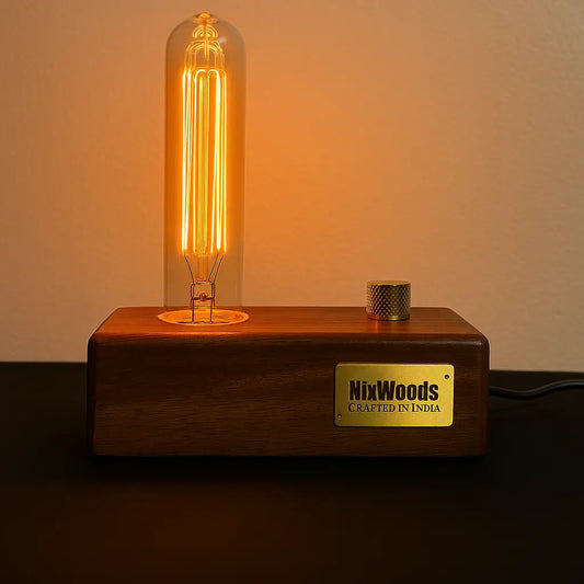 Wooden lamp base with a lit bulb and 'NixWoods' label on a dark background