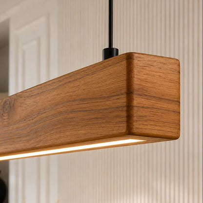 Close-up of teak grain and rounded end of the linear ceiling light with LED underside