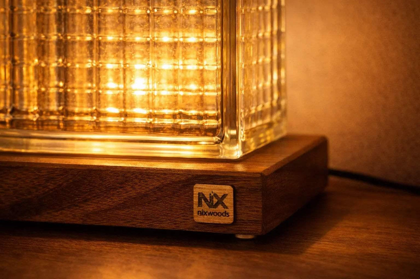 NixWoods Rubik's Cube lamp switched on bedroom bedside warm ambient light
