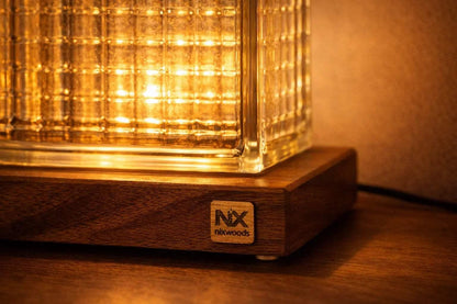NixWoods Rubik's Cube lamp switched on bedroom bedside warm ambient light
