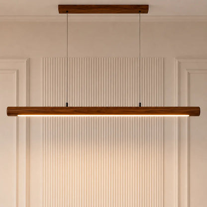 Front view of the rosewood round pendant bar with ceiling canopy against a fluted panel wall