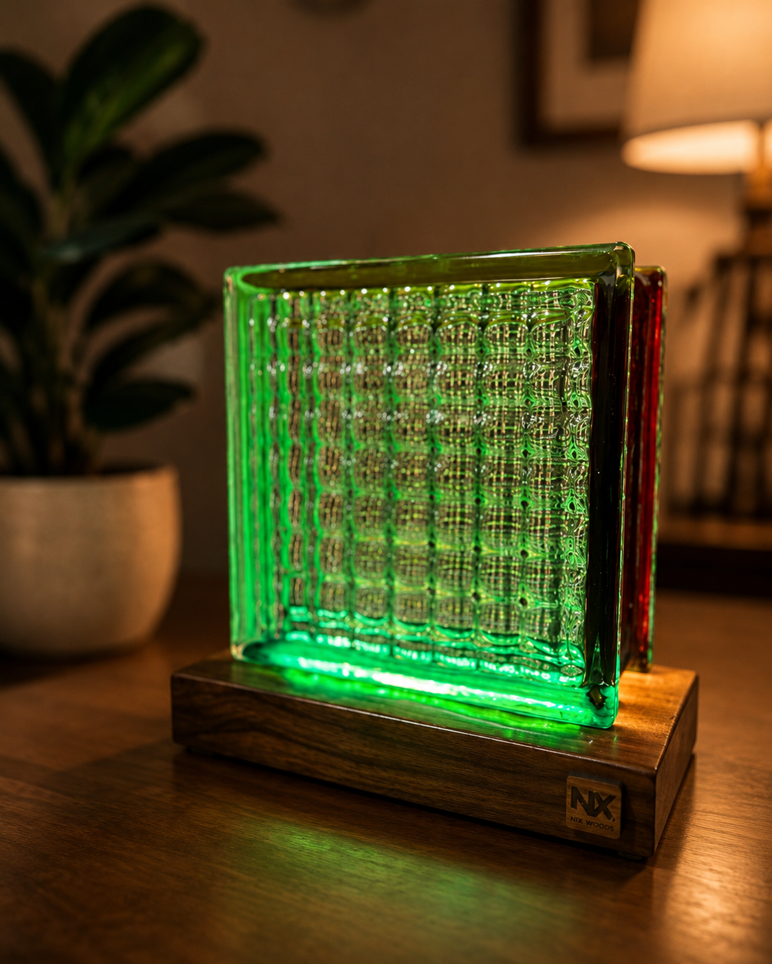 NixWoods Rubik's Cube glass lamp glowing green on a handcrafted Sheesham wood base in a warm living room