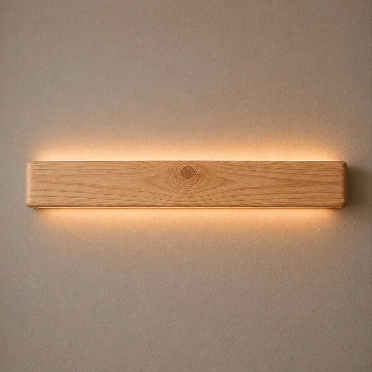 Pine Nix Line 30-inch linear LED wall light glowing warm white on a plain wall