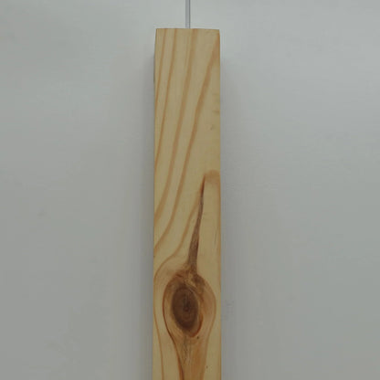 Close view of the natural grain and knot in the Nix Line solid wood wall light - NixWoods sconce