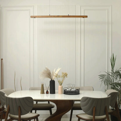Teak linear pendant light above a styled dining table with plants - NixWoods hanging light