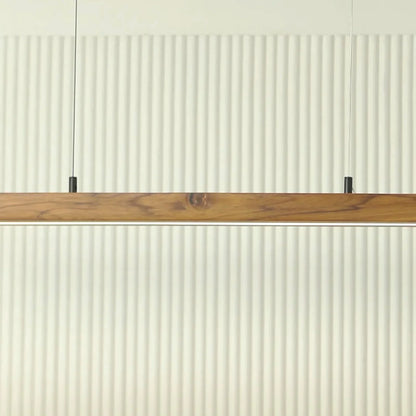 Teak pendant light bar mounted low against a fluted wall - NixWoods wooden hanging light