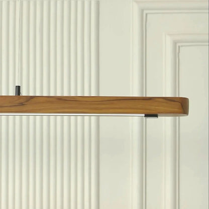 Close view of the solid teak pendant light body and grain - NixWoods linear hanging light
