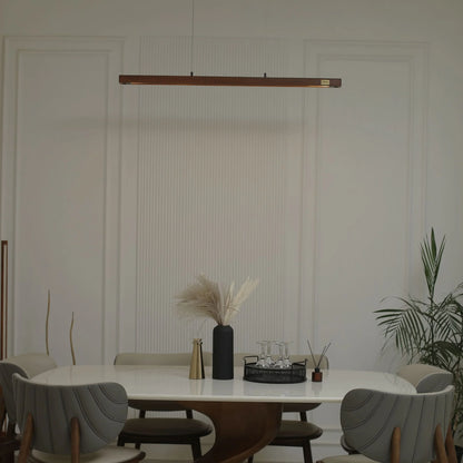 Wooden linear pendant light above a dining table with vase and plant - NixWoods hanging light