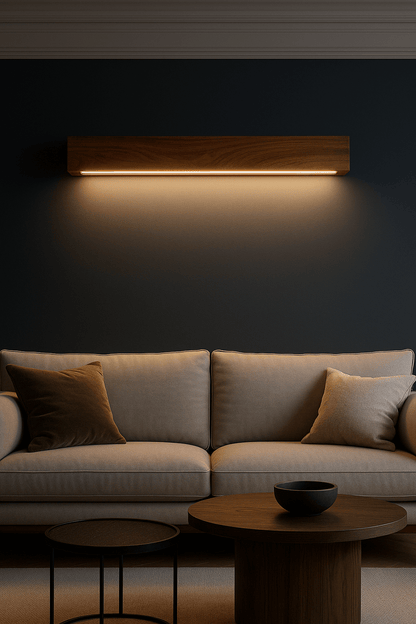 Modern living room with a gray sofa, wooden coffee table, and wall-mounted light fixture.