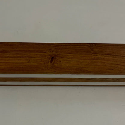 Close detail of the solid rosewood grain on the NixWoods wall lamp body - wooden wall light