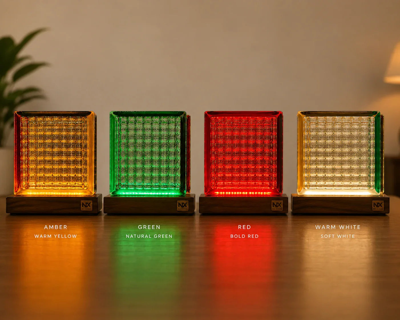 Four colorful square lamps emitting different colored lights on a wooden surface.