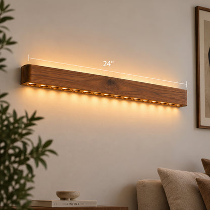 Circular-hole wooden wall light with its 24-inch length marked, warm LED dots above a sofa — NixWoods