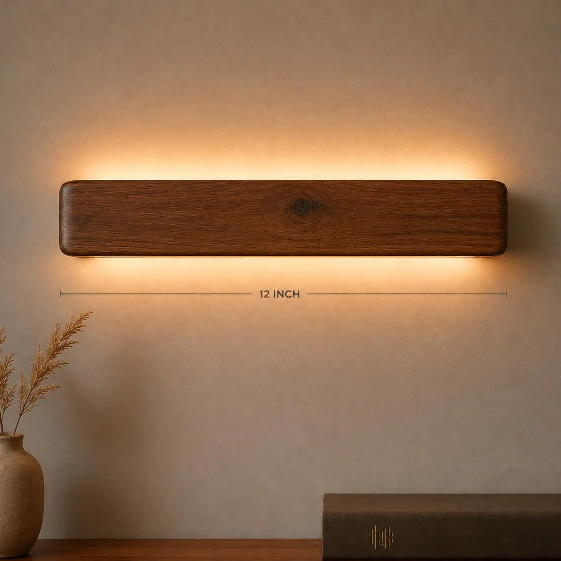 Arden 12-inch rosewood wall light with its length marked, warm LED glow — NixWoods