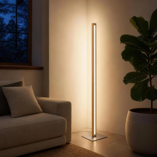 Scandinavian Teak Linear Floor Lamp lighting a living-room corner at dusk beside a linen sofa, warm LED running the full height of the solid teak column