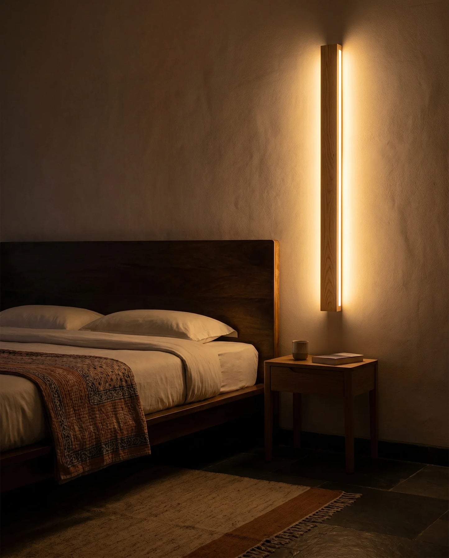 Nix Line wall light beside a bed as a warm bedside wall wash in a modern bedroom — NixWoods